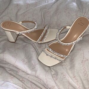 Elegant woman’s pearl heels